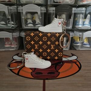 Fashion pair of mini sneakers keychain.